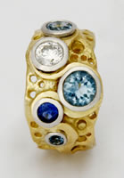 Loop Ring with Diamond, Aqua-marine and blue Sapphires